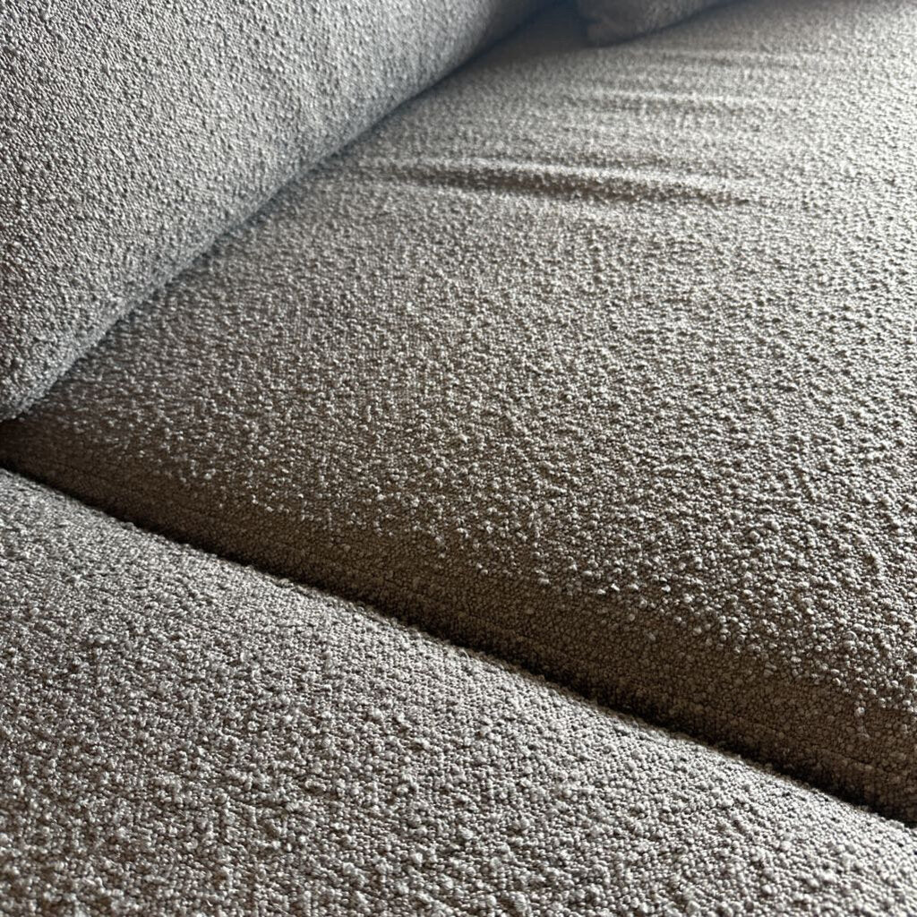 Close-up of textured gray carpet samples