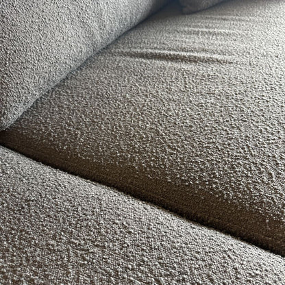 Close-up of textured gray carpet samples