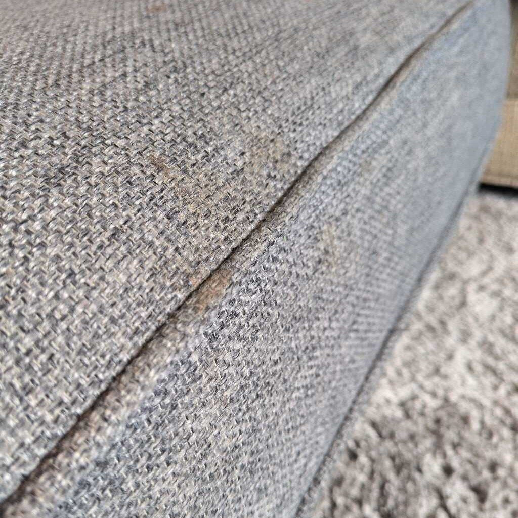 Close-up of a textured gray fabric surface