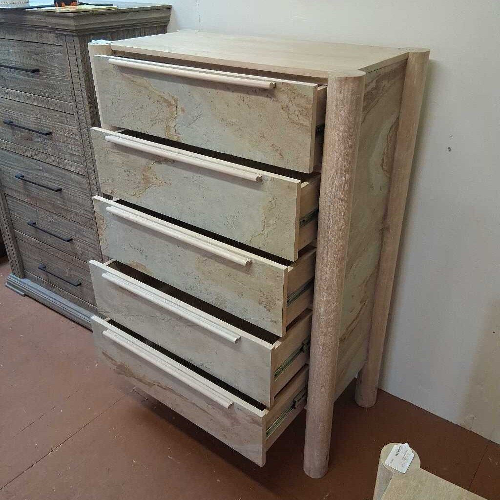 Wooden dresser with multiple drawers in a room setting
