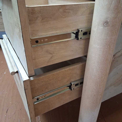 Wooden drawer with metal slides on a wooden cabinet