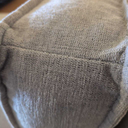 Close-up of a textured gray fabric surface