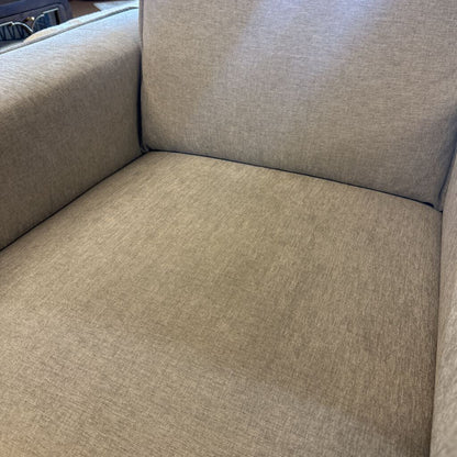 Gray fabric sofa with a focus on texture and color.