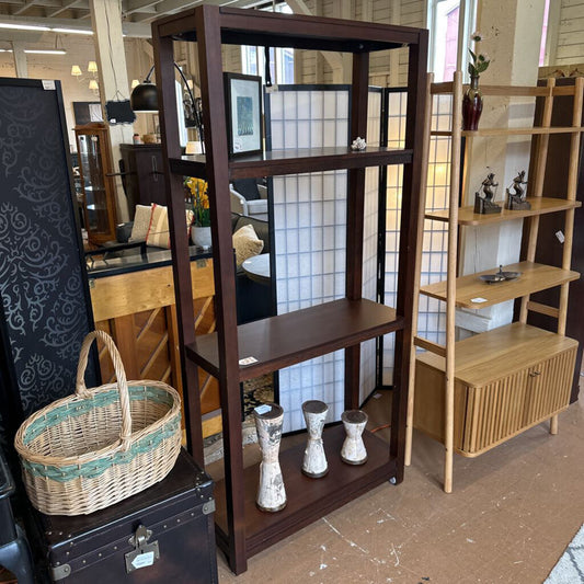 Wooden shelves with decorative items in a store setting