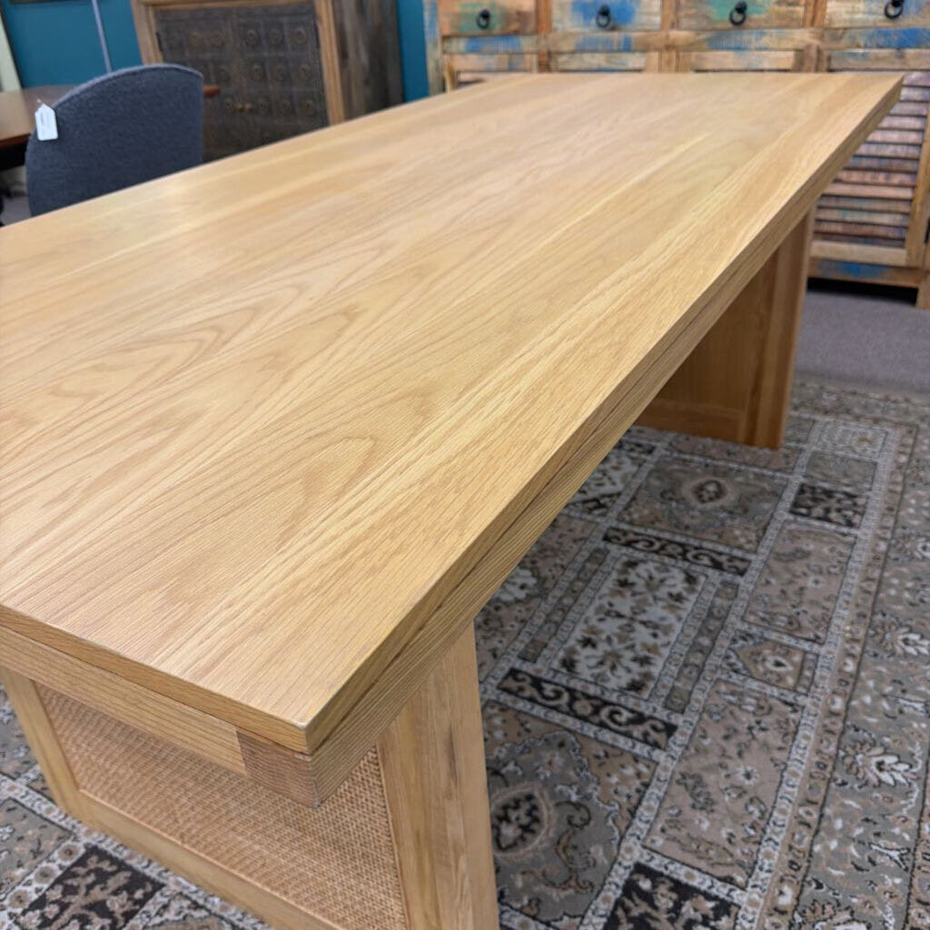 Wooden desk in a room with patterned carpet