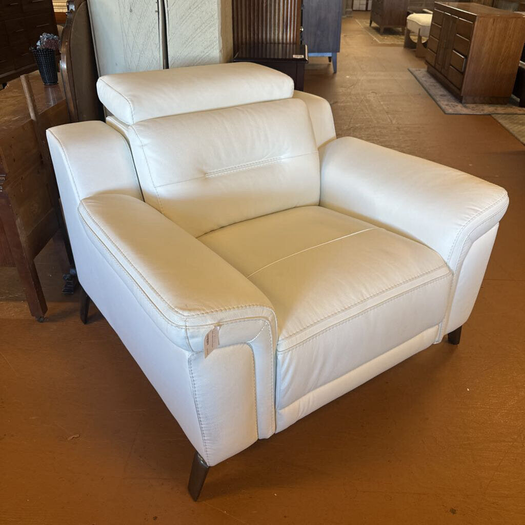 White leather armchair in a showroom setting