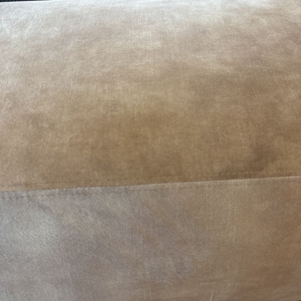 Close-up of a textured brown fabric surface