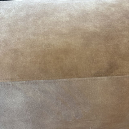 Close-up of a textured brown fabric surface