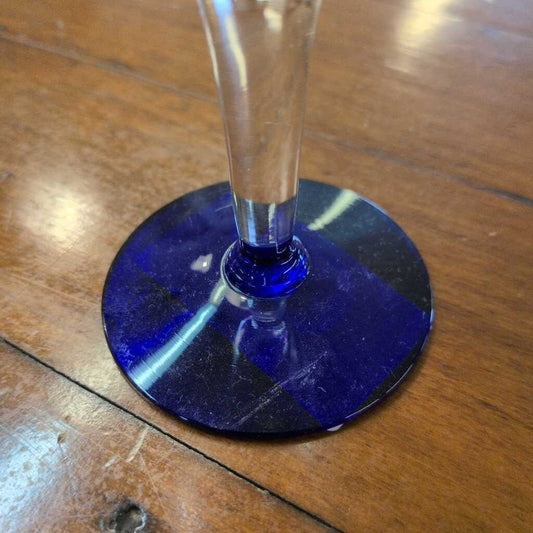 Blue glass coaster on a wooden surface