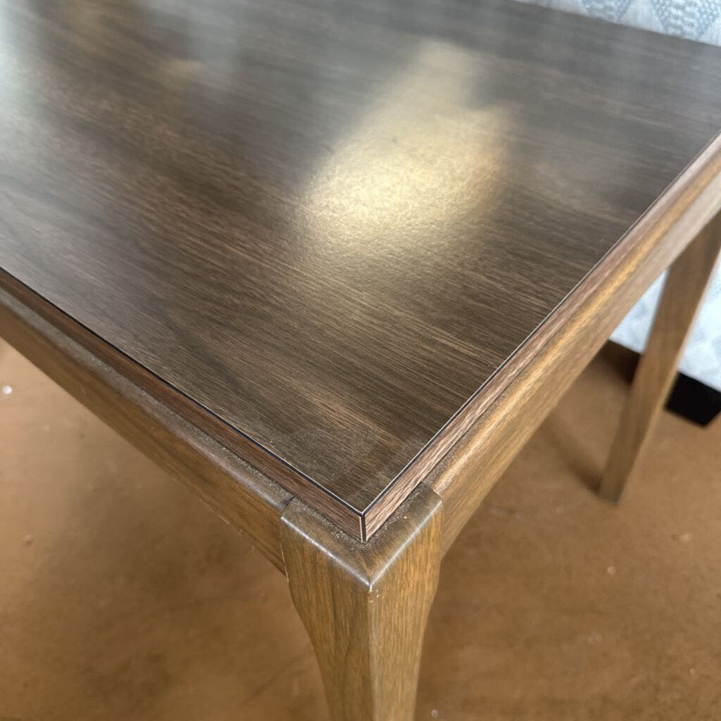 Wooden table with a reflective surface
