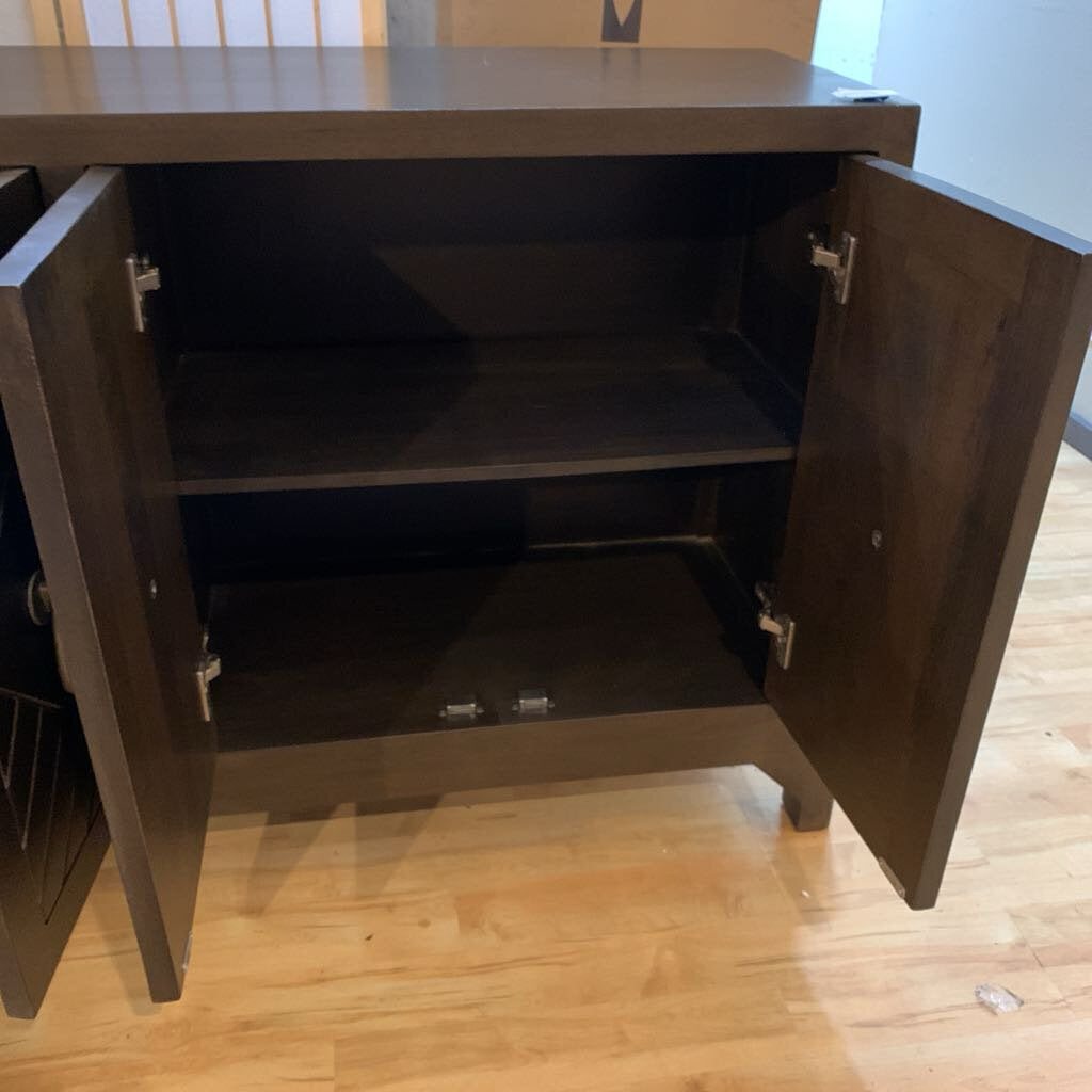 Wooden cabinet with open doors on a wooden floor