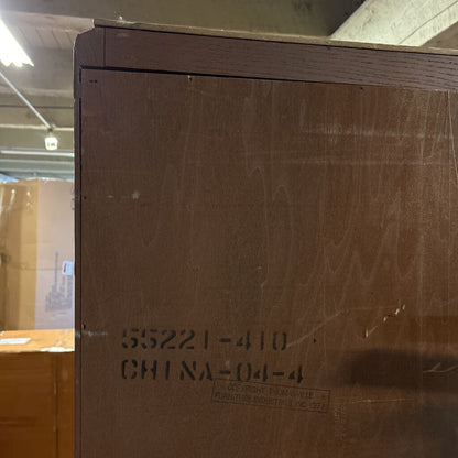 Cardboard box with shipping labels in a warehouse setting
