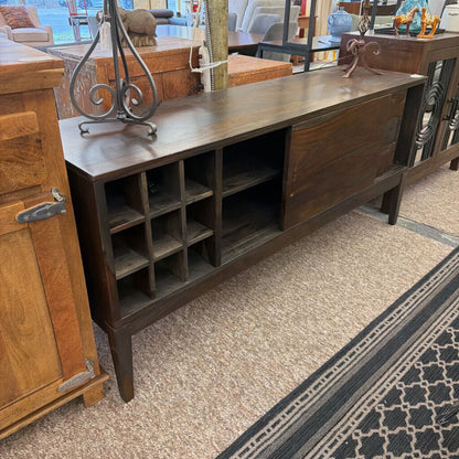 Wooden sideboard with shelves in a room setting