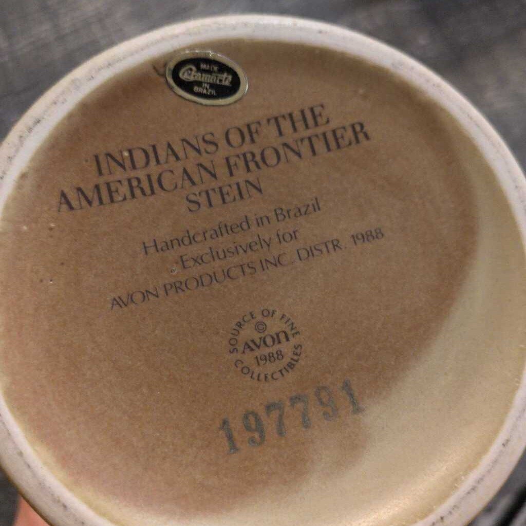 Base of a ceramic item with 'Indians of the American Frontier Stein' text and Avon branding.