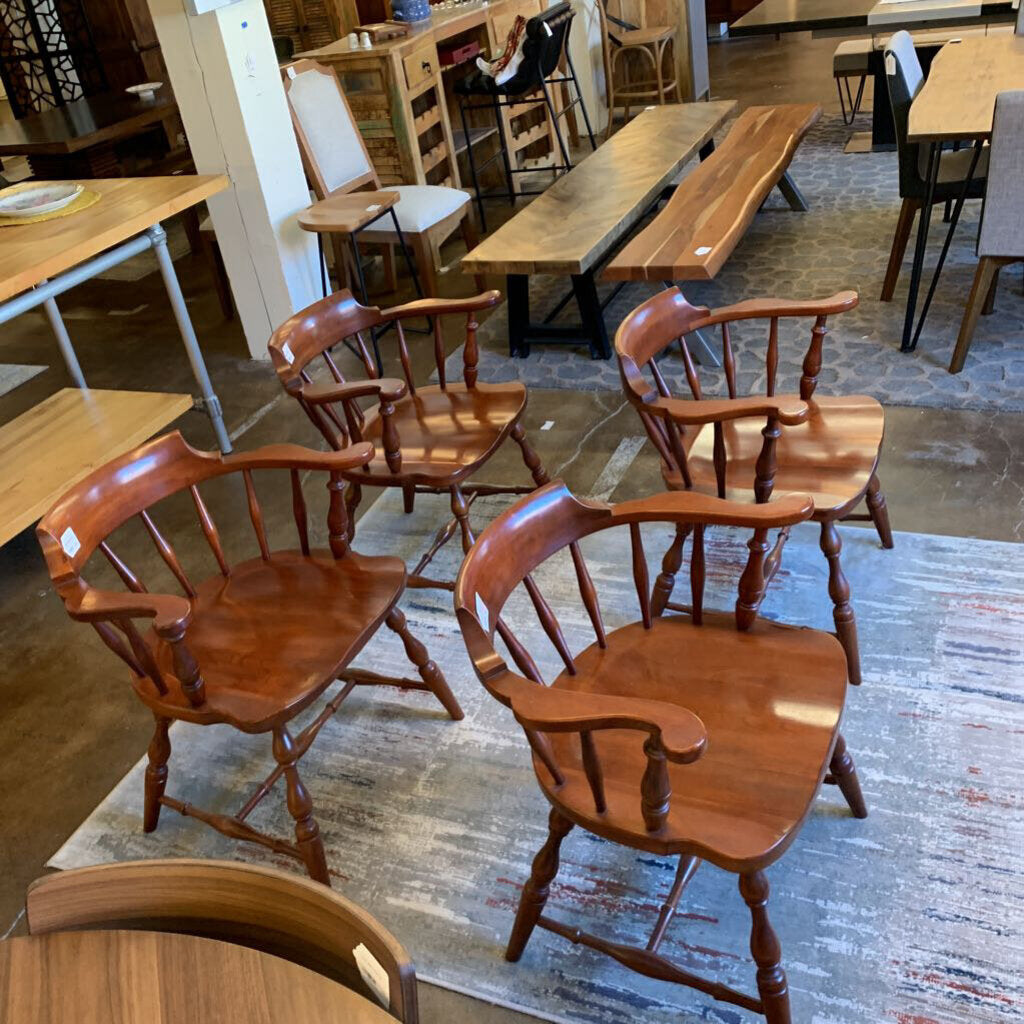 Wooden chairs and tables in a storage or warehouse setting