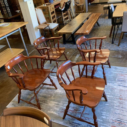 Wooden chairs and tables in a storage or warehouse setting