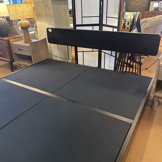 Black dining table with chair in a room setting