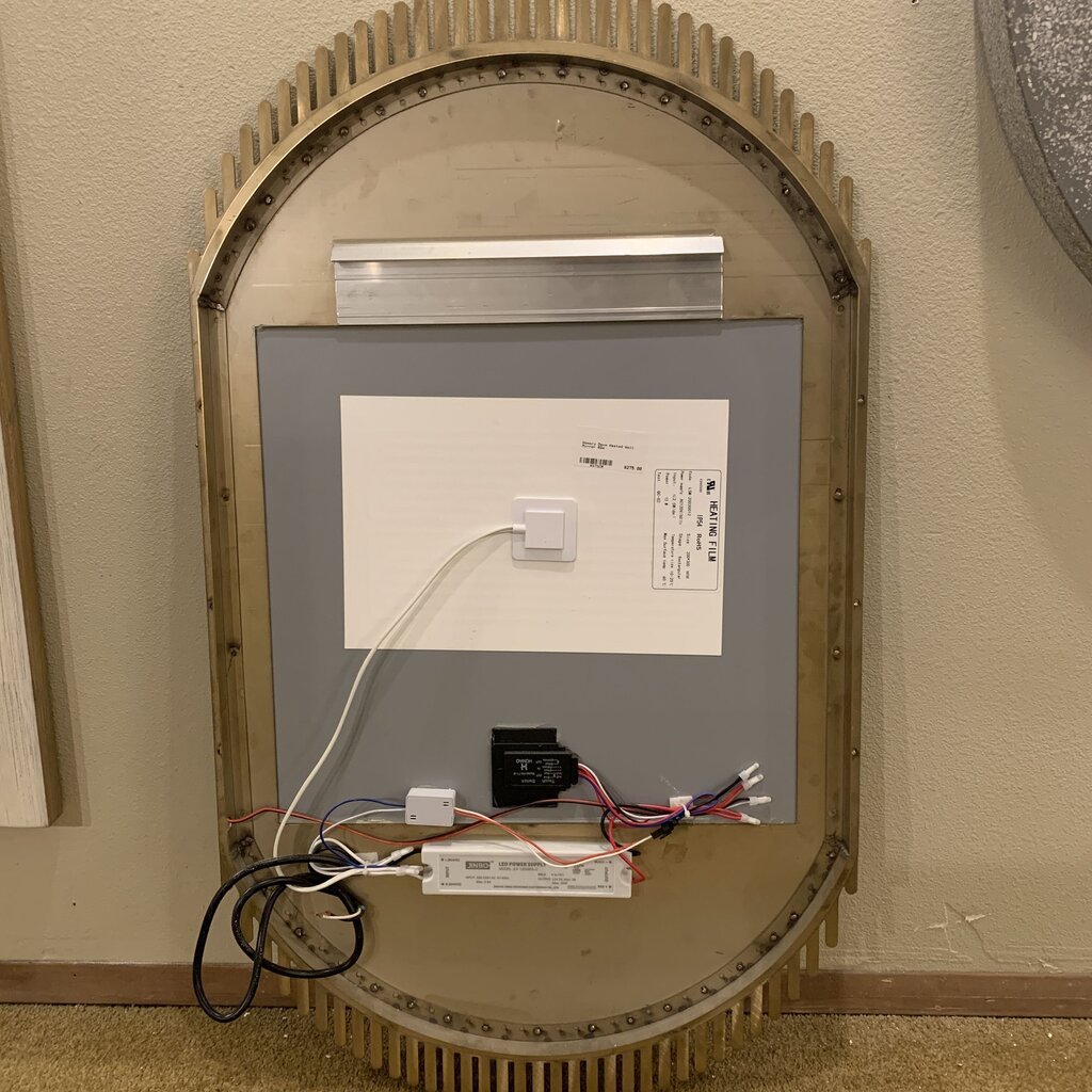 Electrical panel with wires and components on a wall