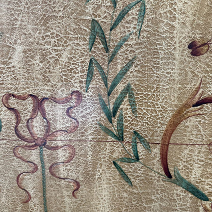 Decorative floral design on a textured beige background