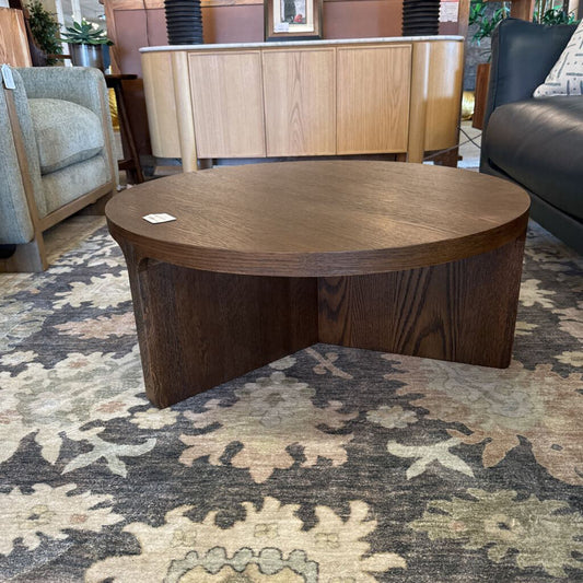 Wooden coffee table in a room with furniture and decor
