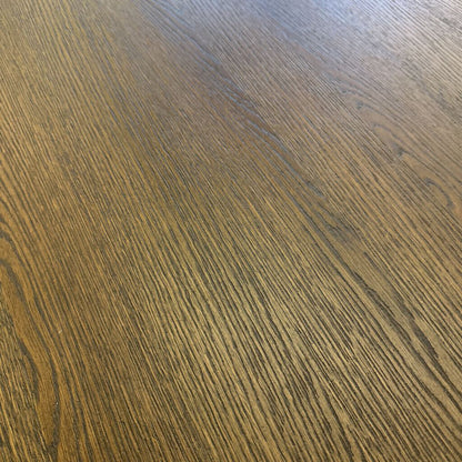 Close-up of a wooden surface with a dark brown finish