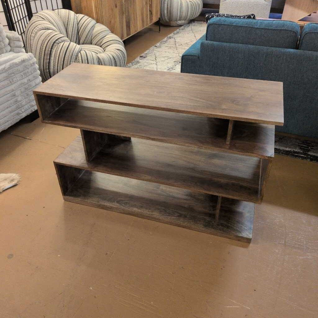 Wooden shelf with two levels in a room with furniture