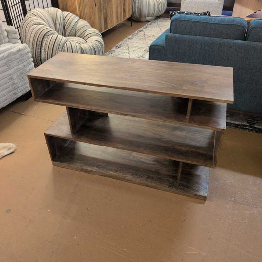 Wooden shelf with two levels in a room with furniture