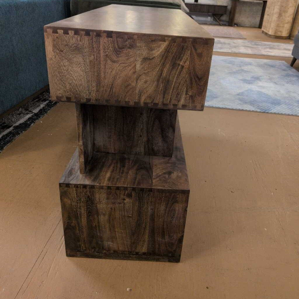 Wooden side table with a textured finish in a room setting