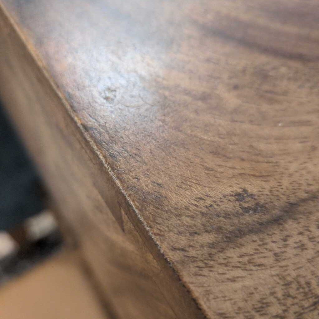 Close-up of a wooden surface with a blurred background