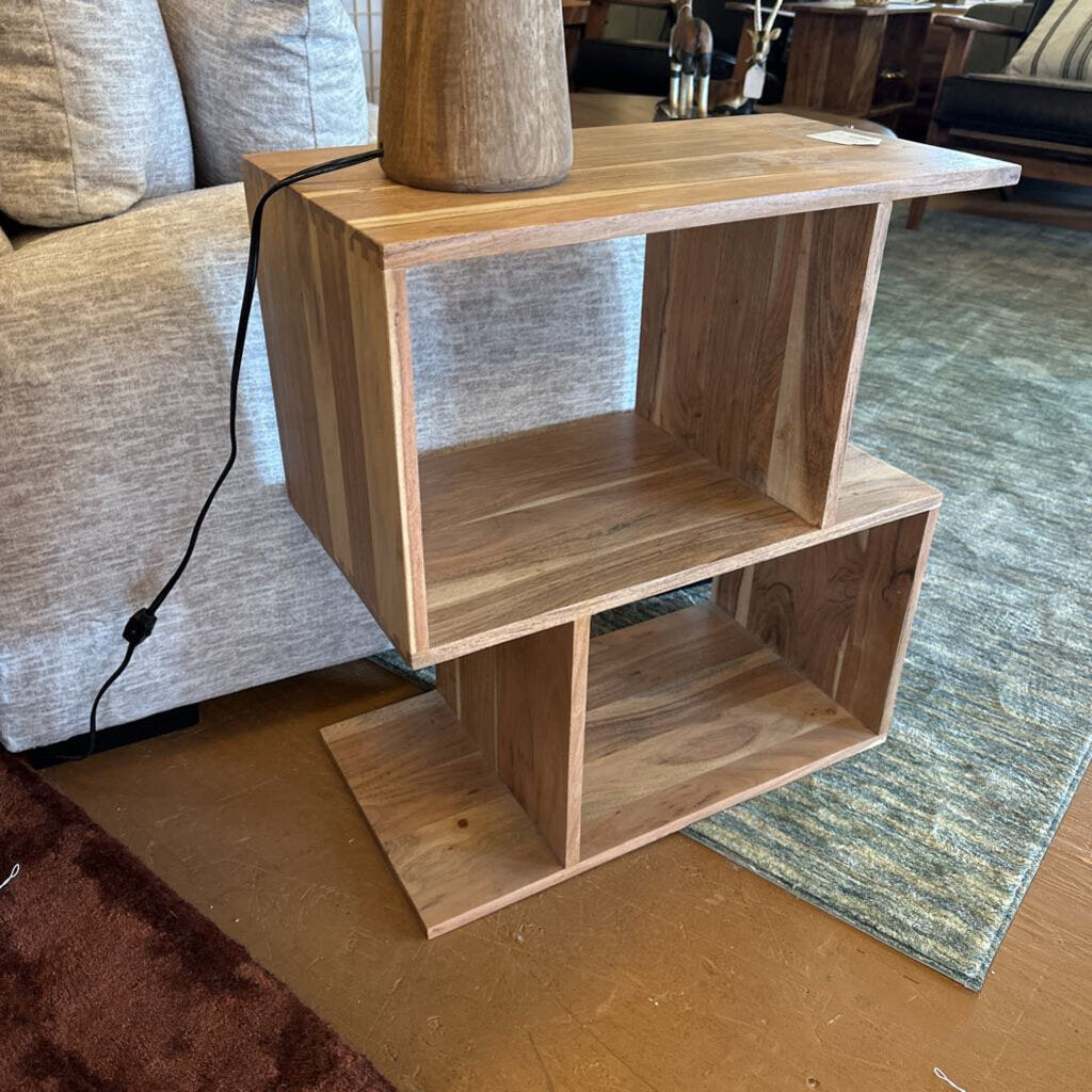 Wooden side table with shelves in a living room setting