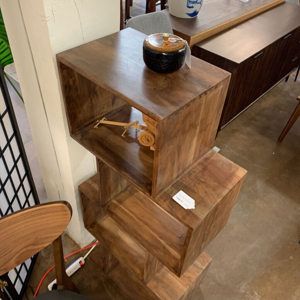 Wooden shelf with decorative items in a casual indoor setting