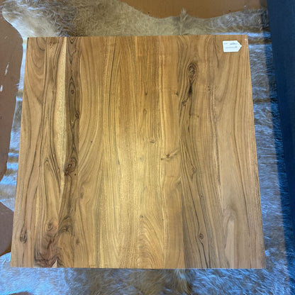 Wooden panel with a visible grain pattern on a blue surface