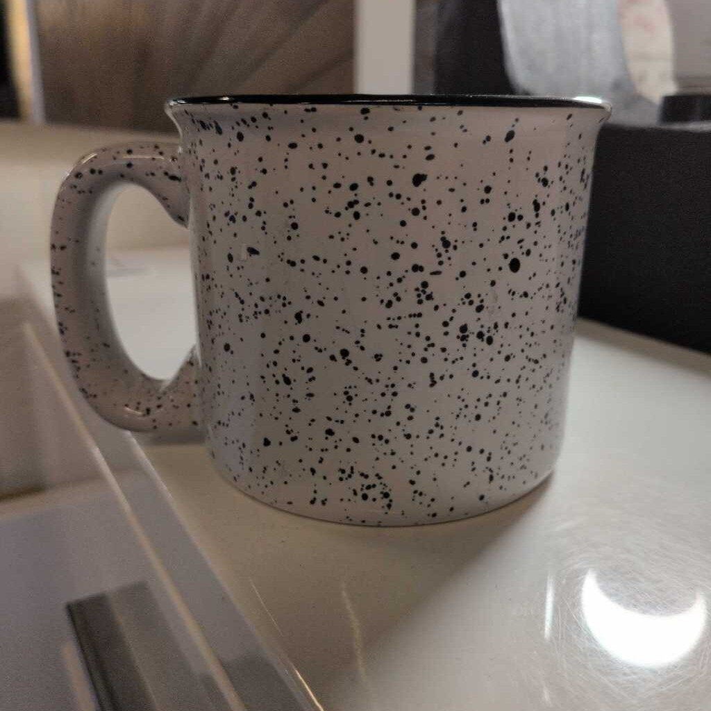 Speckled mug on a kitchen counter