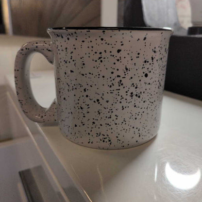 Speckled mug on a kitchen counter
