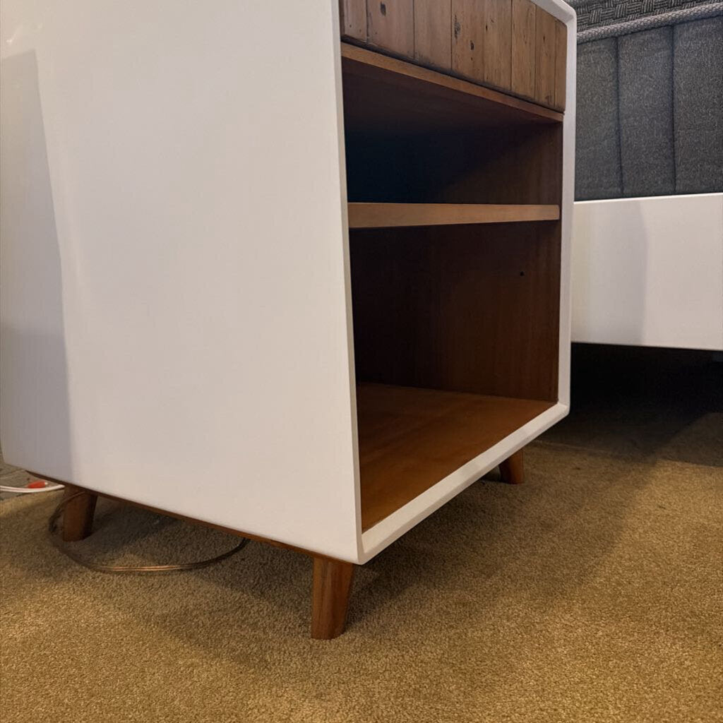 White cabinet with wooden shelves on a carpeted floor
