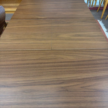 Wooden dining table with a visible grain pattern