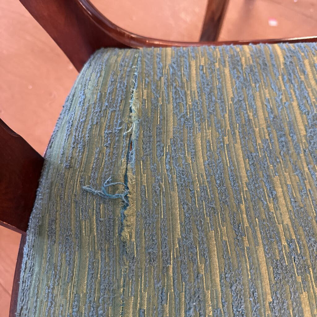 Close-up of textured green and brown fabric on a chair