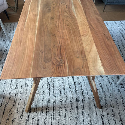 Wooden table on a patterned rug