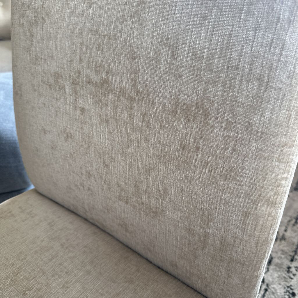 Close-up of a textured beige fabric surface