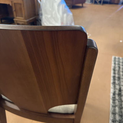 Close-up of a wooden chair with a blurred background