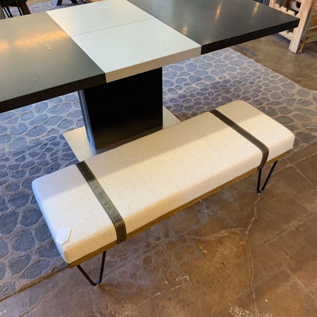 Dining table with a bench on a stone floor