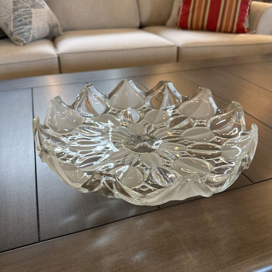 Clear glass bowl with floral design on a wooden table