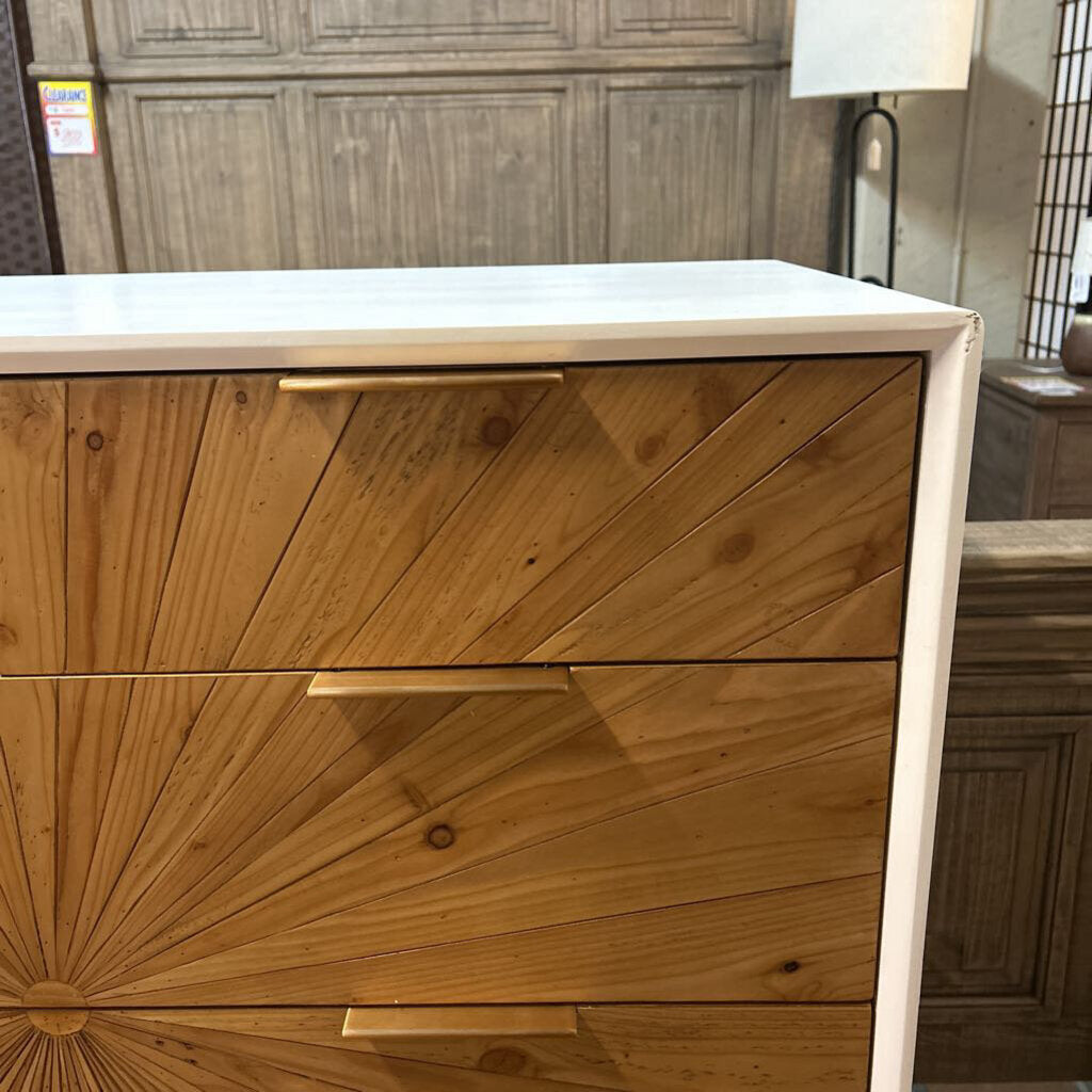 Wooden dresser with geometric pattern in a room setting