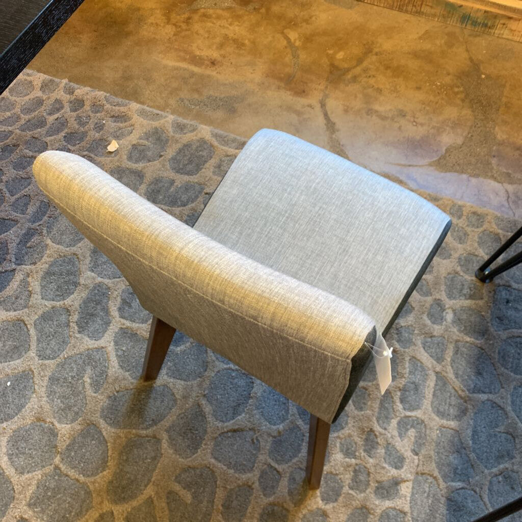 Chair with a protective cover on a stone floor