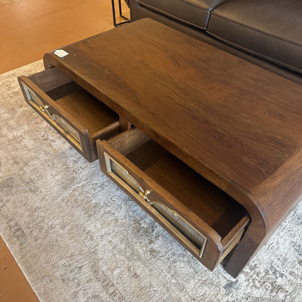 Wooden coffee table with drawers in a living room setting