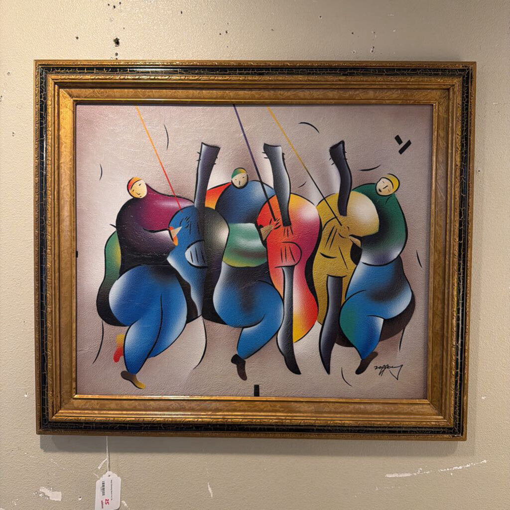 Framed abstract artwork with colorful figures on a beige background