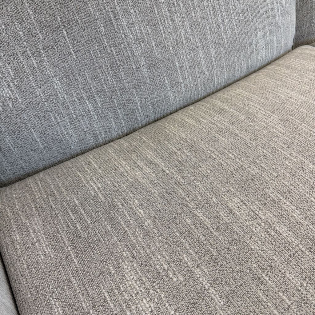 Close-up of a textured gray fabric surface