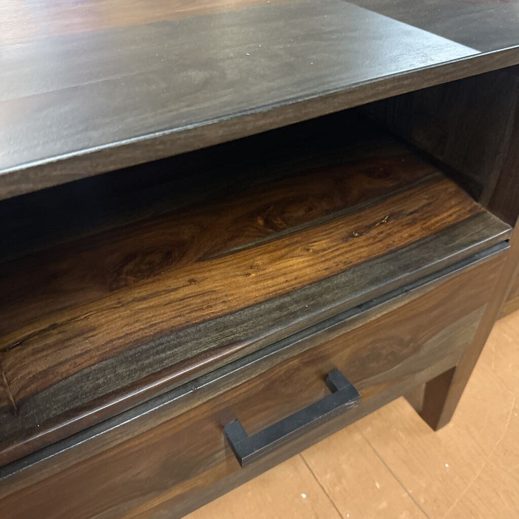 Wooden drawer with metal handle on a wooden floor