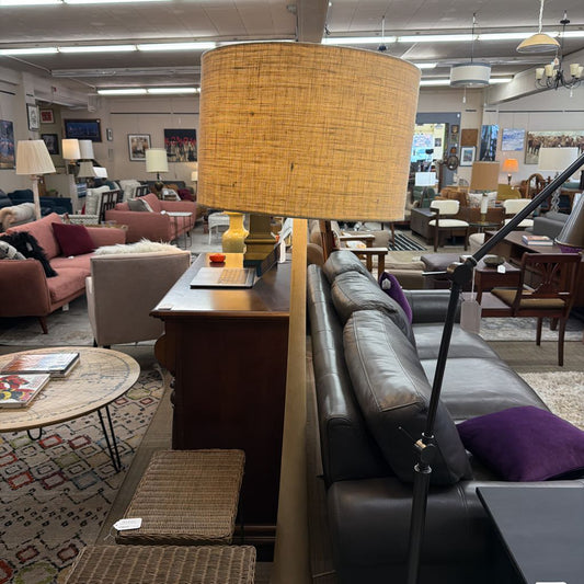 Furniture store with a lamp, couch, and various decor items.