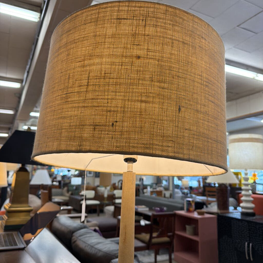 Lamp with a brown textured shade in a store setting